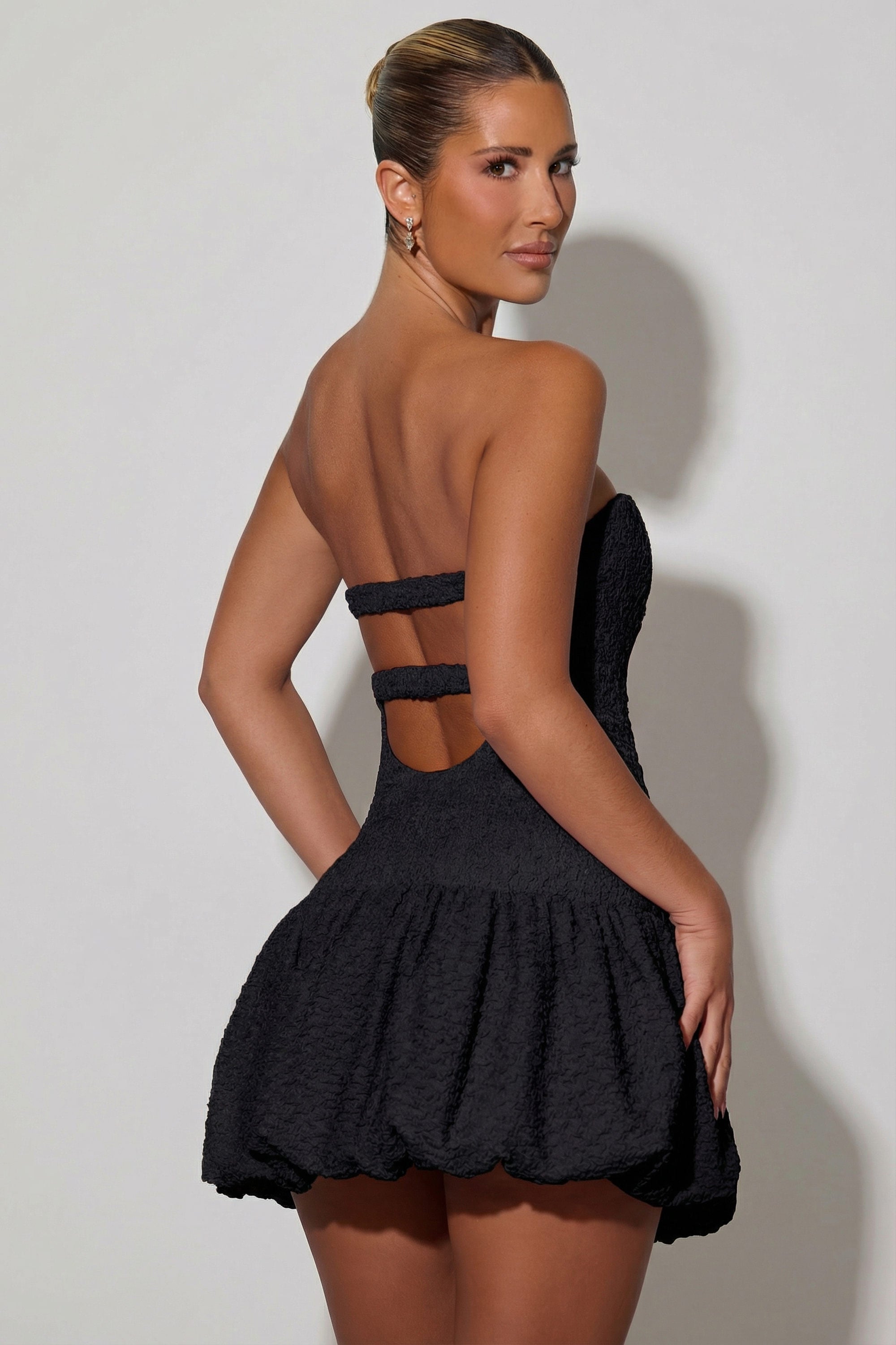 Cut-Out Bubble Hem Corset Mini Dress in Black